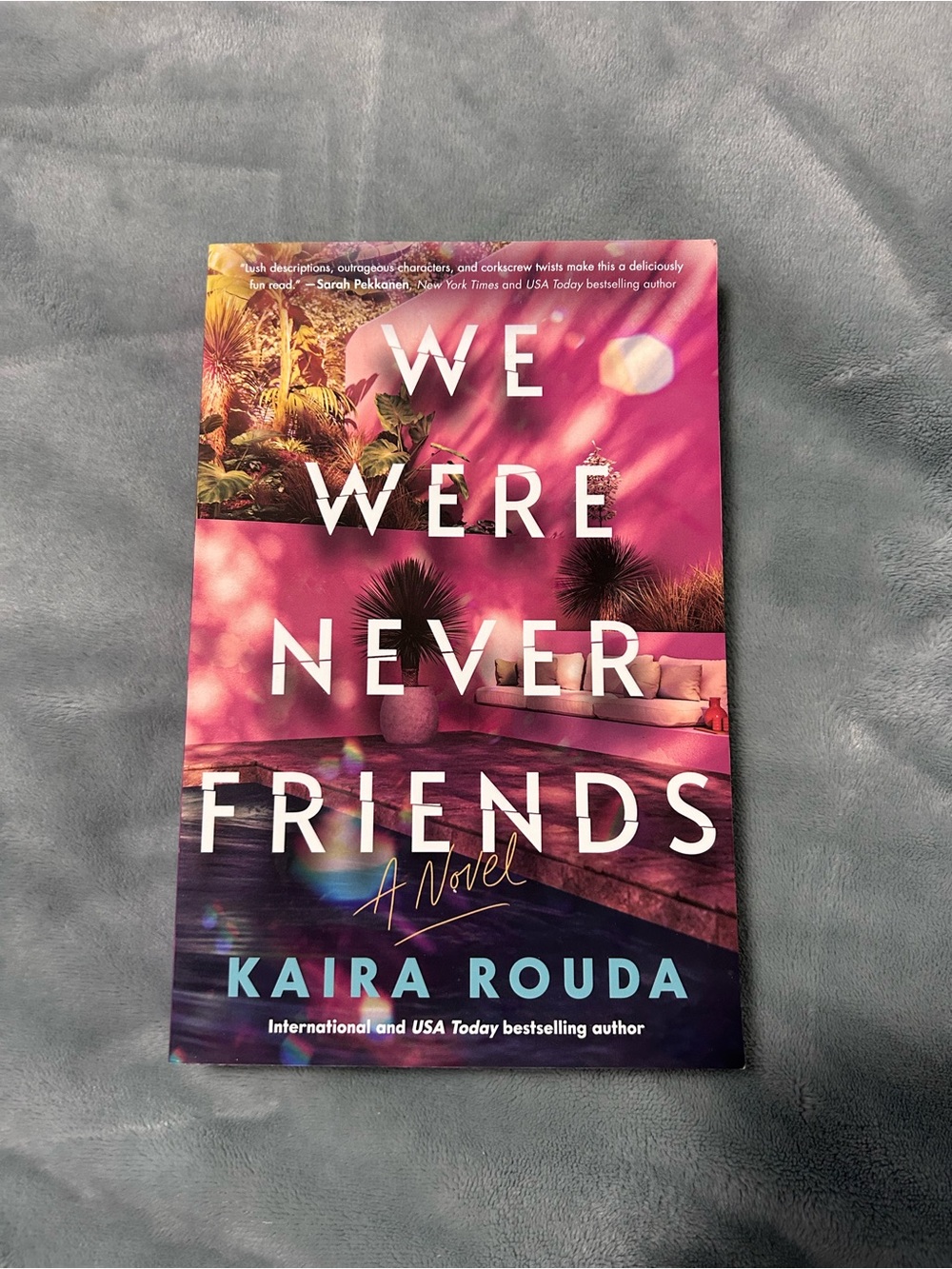 We Were Never Friends by Kaira Rouda - Pink & Teal Paperback